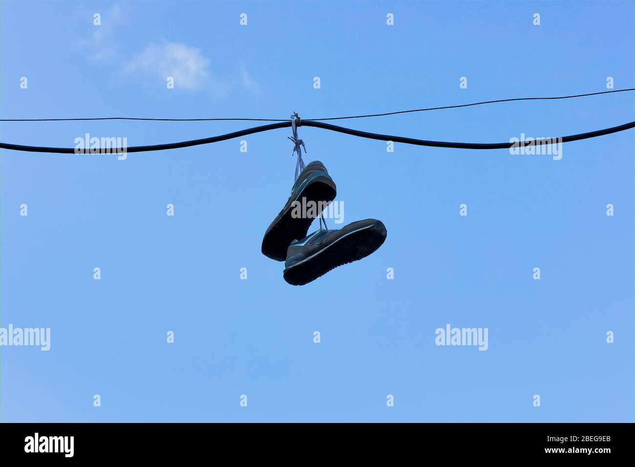 Sneakers hanging telephone wire hires stock photography and images Alamy