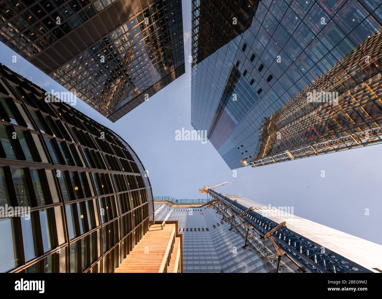 Photo inspiration: Low Angle View Of Tall Corporate Glass Skyscrapers Reflecting A Photo Inspiration