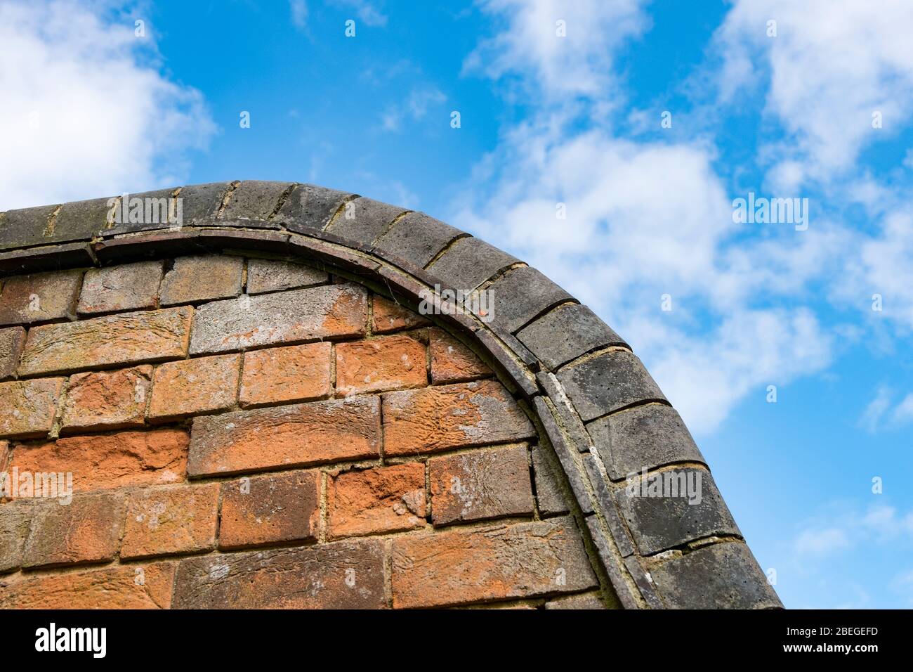 Blue brick capstones on top of brick wall Stock Photo Alamy