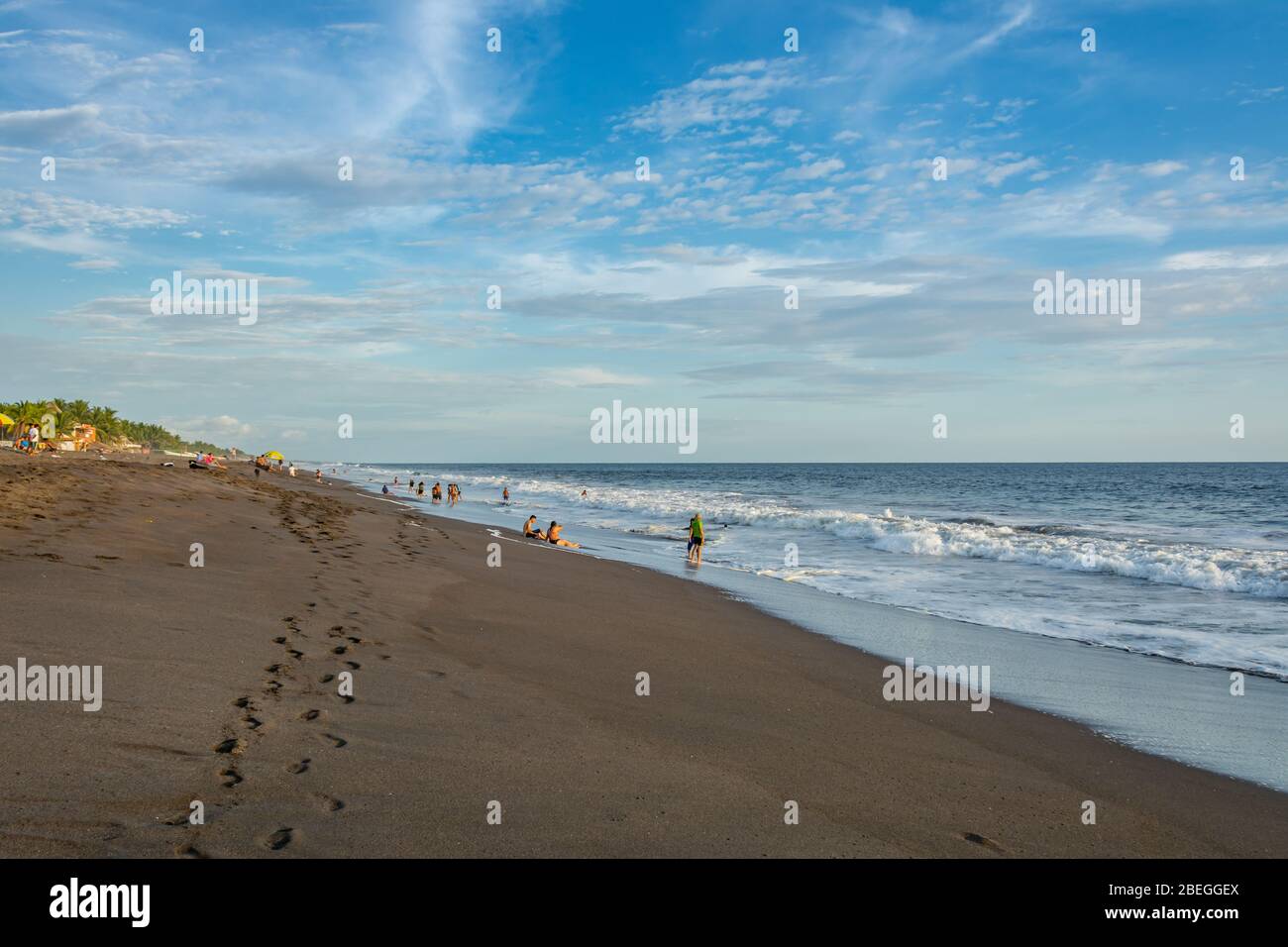 People enjoying the ocean at Monterrico Beach, Guatemala Stock Photo