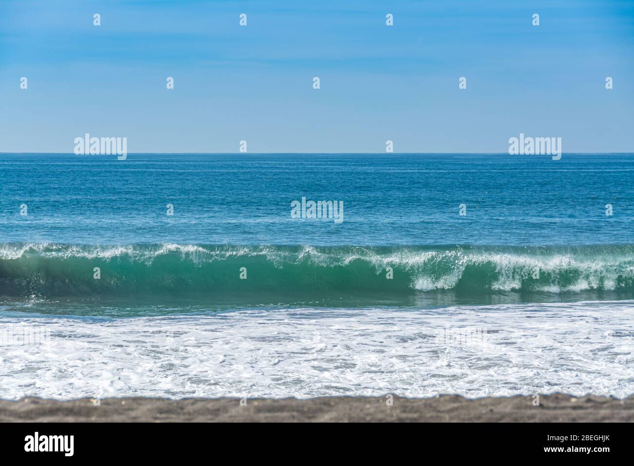 Ocean waves on the beach at Monterrico Beach, Guatemala Stock Photo
