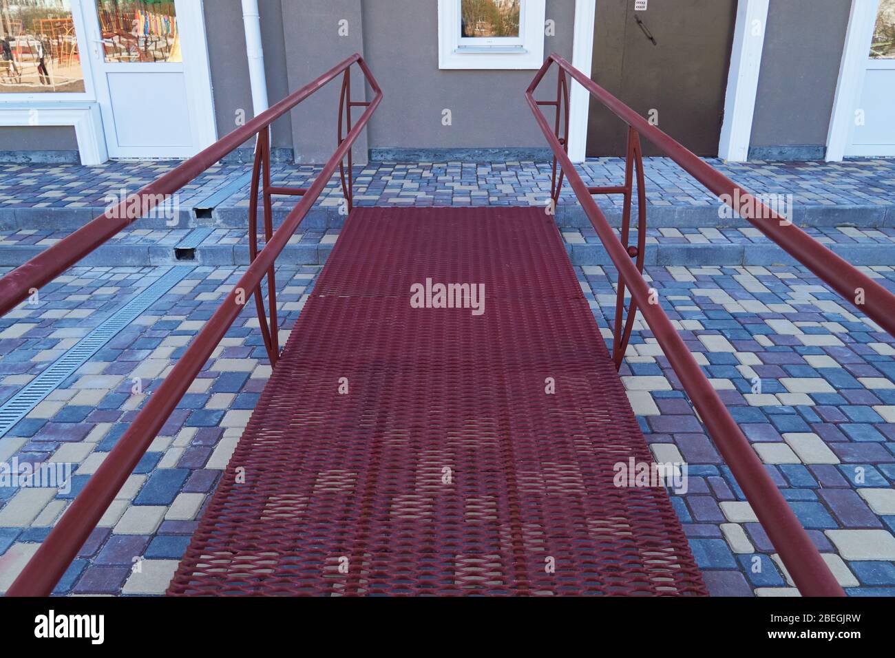 Wheelchair access ramp for entrance of residential multistory building