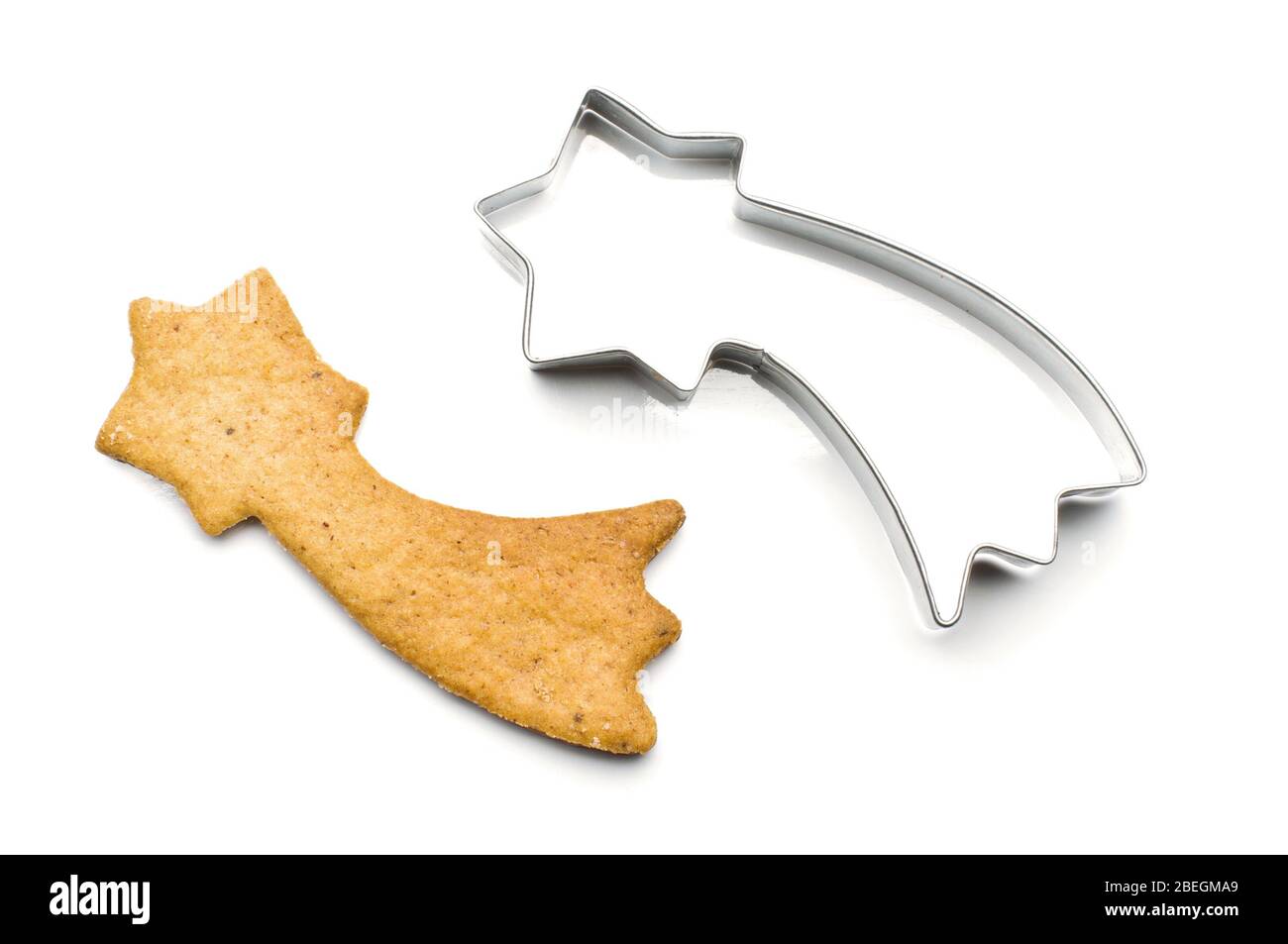 Comet shape biscuit and tin dough cutting shape for baking isolated on