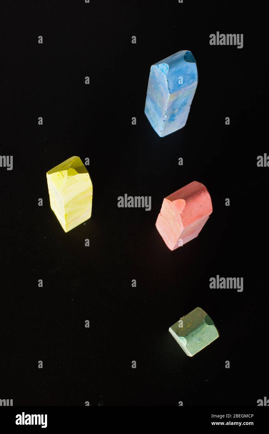 Multicolor chalks standing on the blackboard top view isolated Stock ...