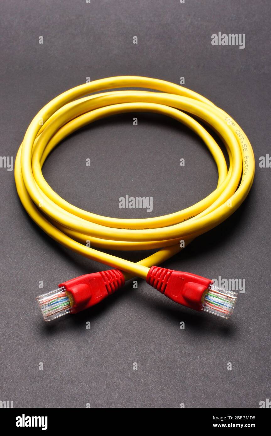 Yellow color LAN cable for connection Stock Photo Alamy