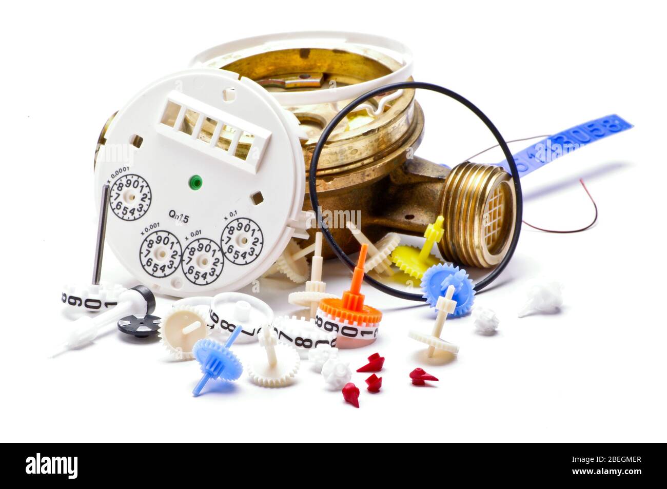 Internal mechanical parts from broken water meter isolated on the white