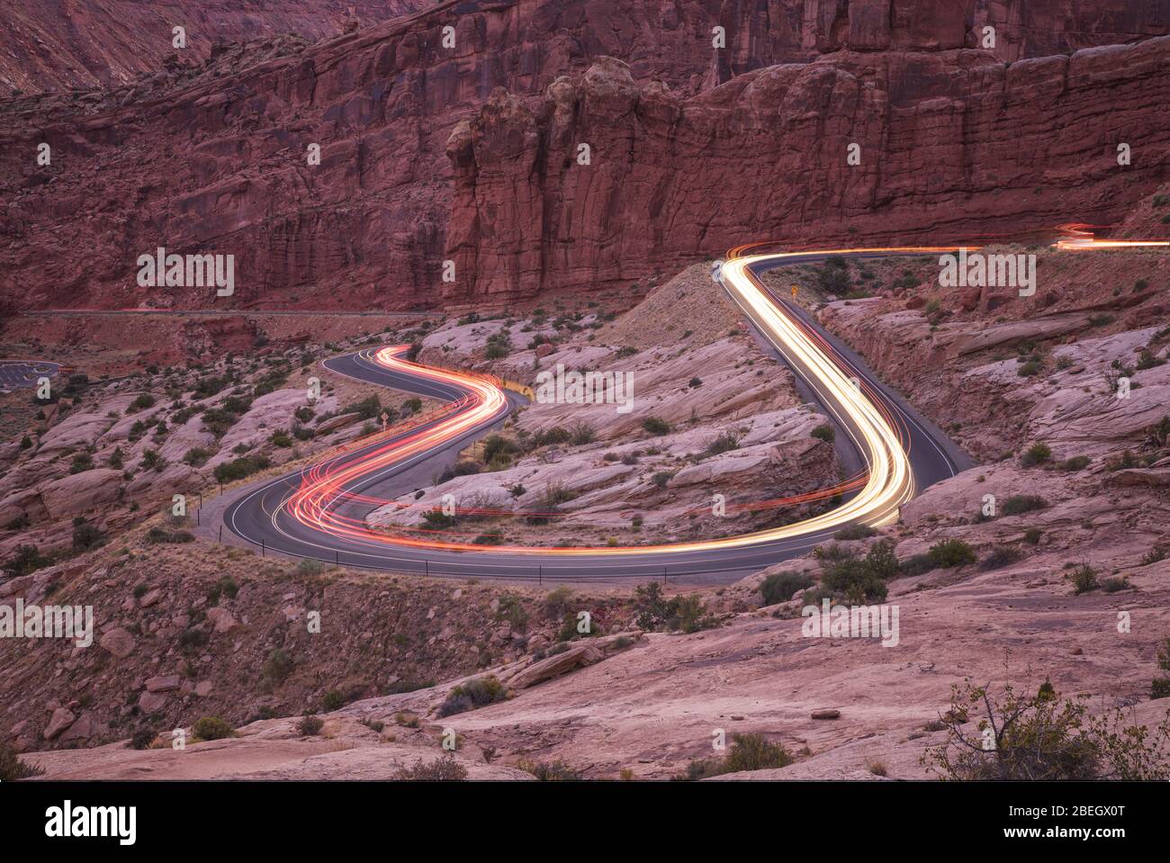 car trails on the roads of Arches national park Stock Photo