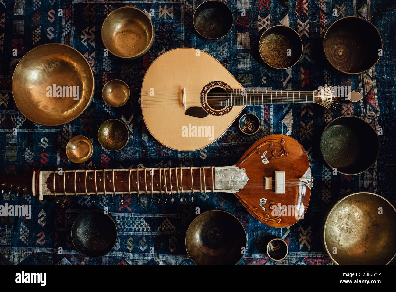 Traditional instruments: sitar and portuguese guitar and singing bowls Stock Photo