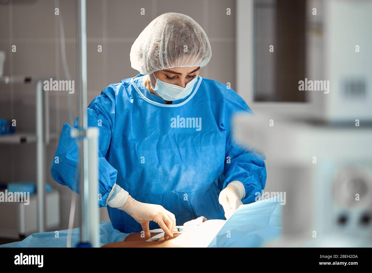 Photographs of doctors in protective masks and lab coats work