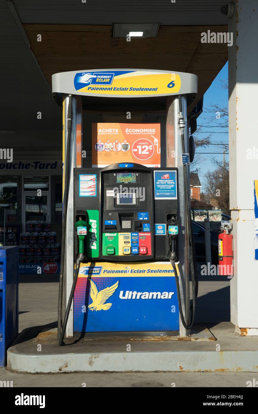 Modern fuel pump labeled in French at an Ultramar petrol station, province of Quebec, Canada. Stock Photo