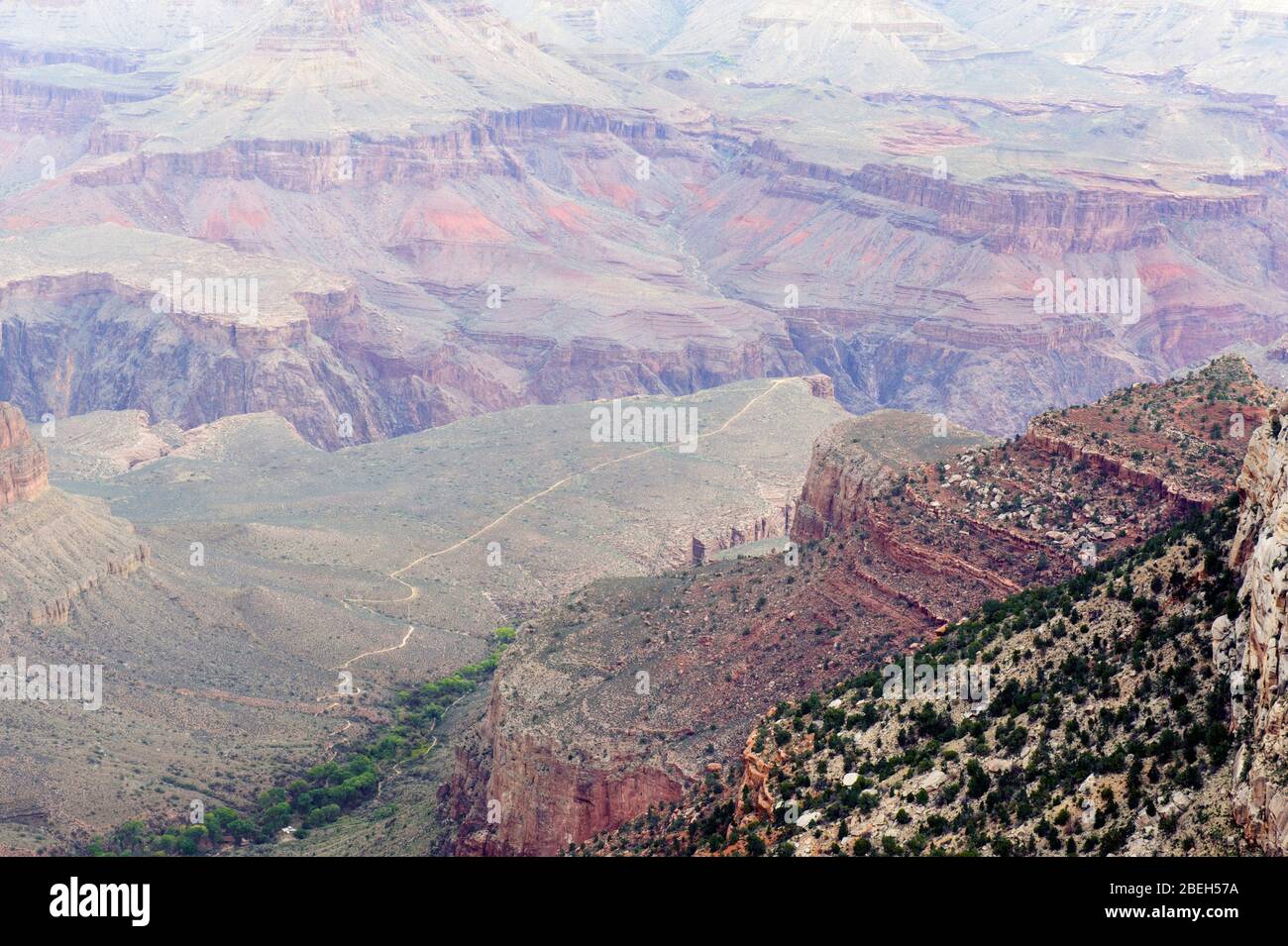 Looking down  into Grand Canyon from the South Rim. Bright Angel trail is visible in the distance. Stock Photo