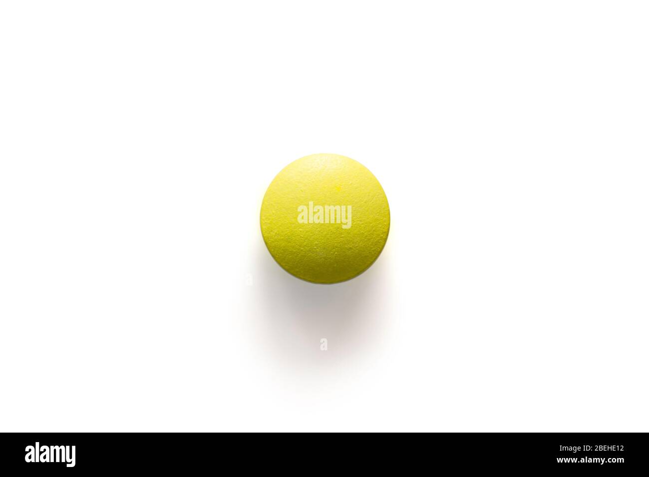 Yellow pill chlorpheniramine on white background with clipping path and ...