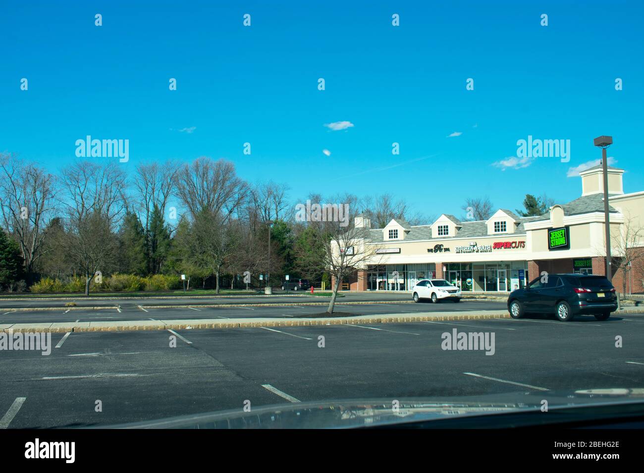 Few shoppers are found in an otherwise busy strip mall in Marlboro, New Jersey, on Monday, April 6th, 2020, due to Covid-19 restrictions -04 Stock Photo