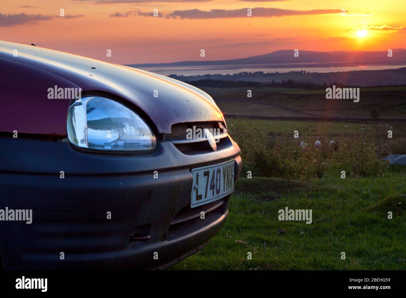 1993  L Registration burgundy 3 door hatchback Vauxhall / Opel Corsa car at sunset Stock Photo