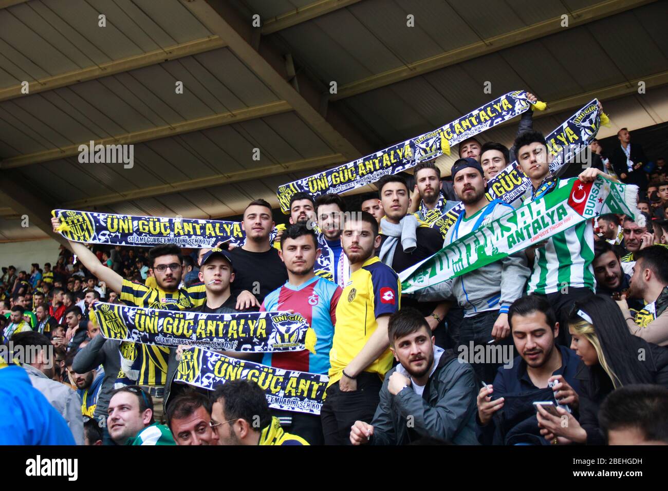 Ankara/Turkey - 05.03.2017 :A group of young Turkish football fans holding team scarves in tribune Stock Photo
