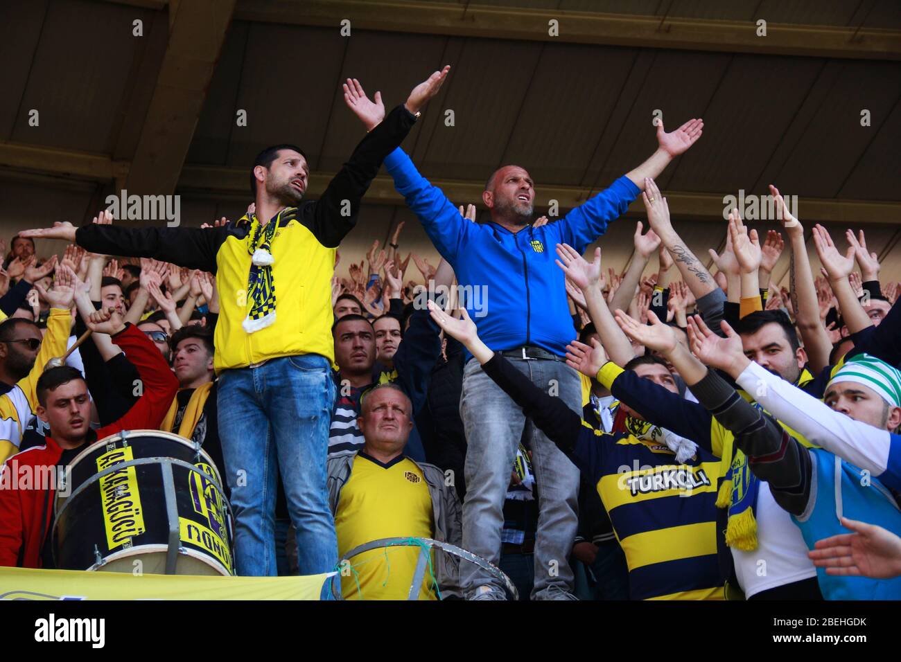 Ankara/Turkey - 05.03.2017 :Two football fans standing and cheering the crowd Stock Photo