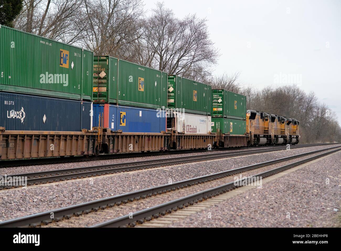 La Fox, Illinois, USA. Three Union Pacific Railroad locomotives lead an eastbound container or stack freight train through a rural section Illinois. Stock Photo