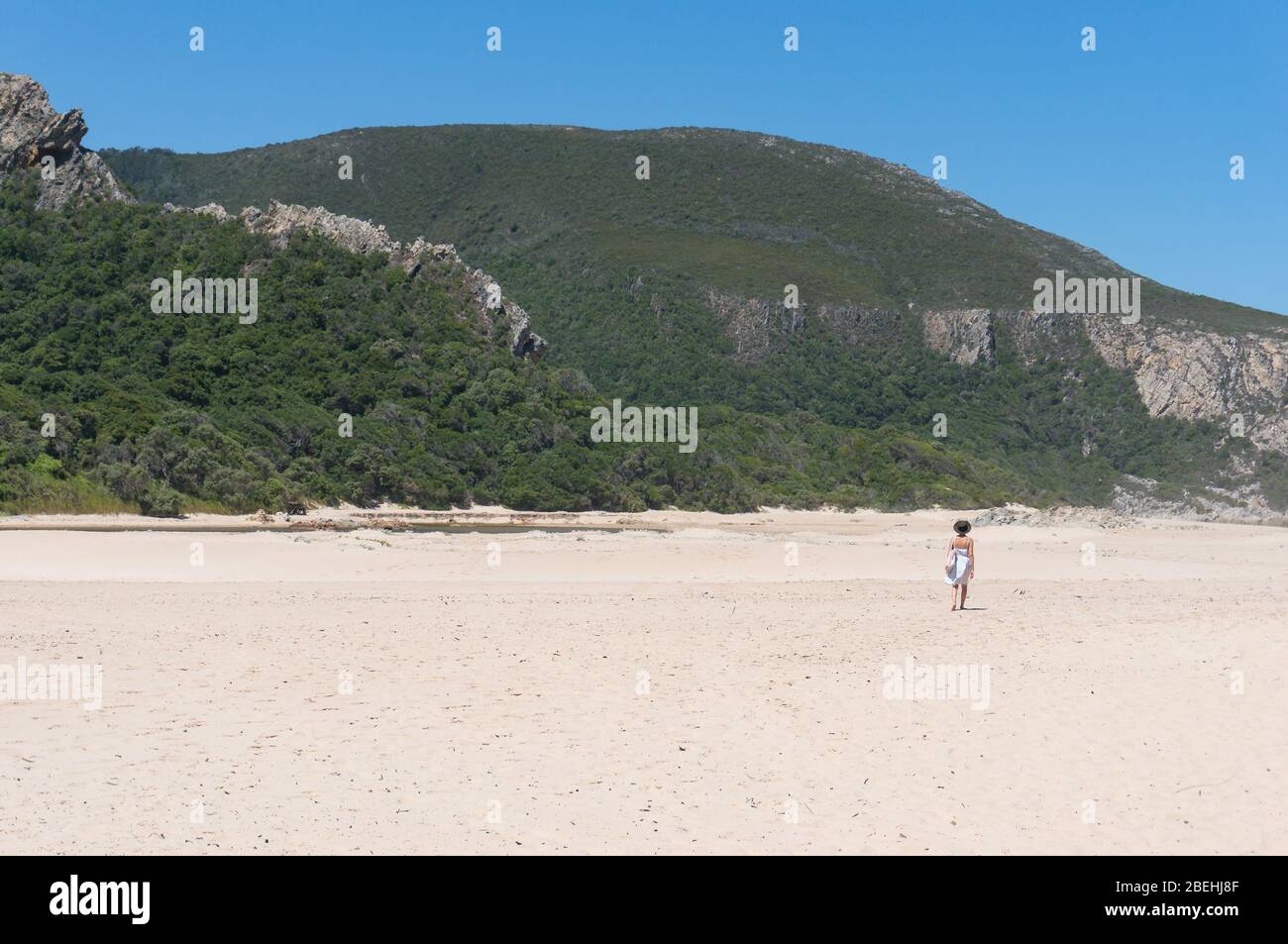 Woman walking beach alone dress hi-res stock photography and images - Alamy