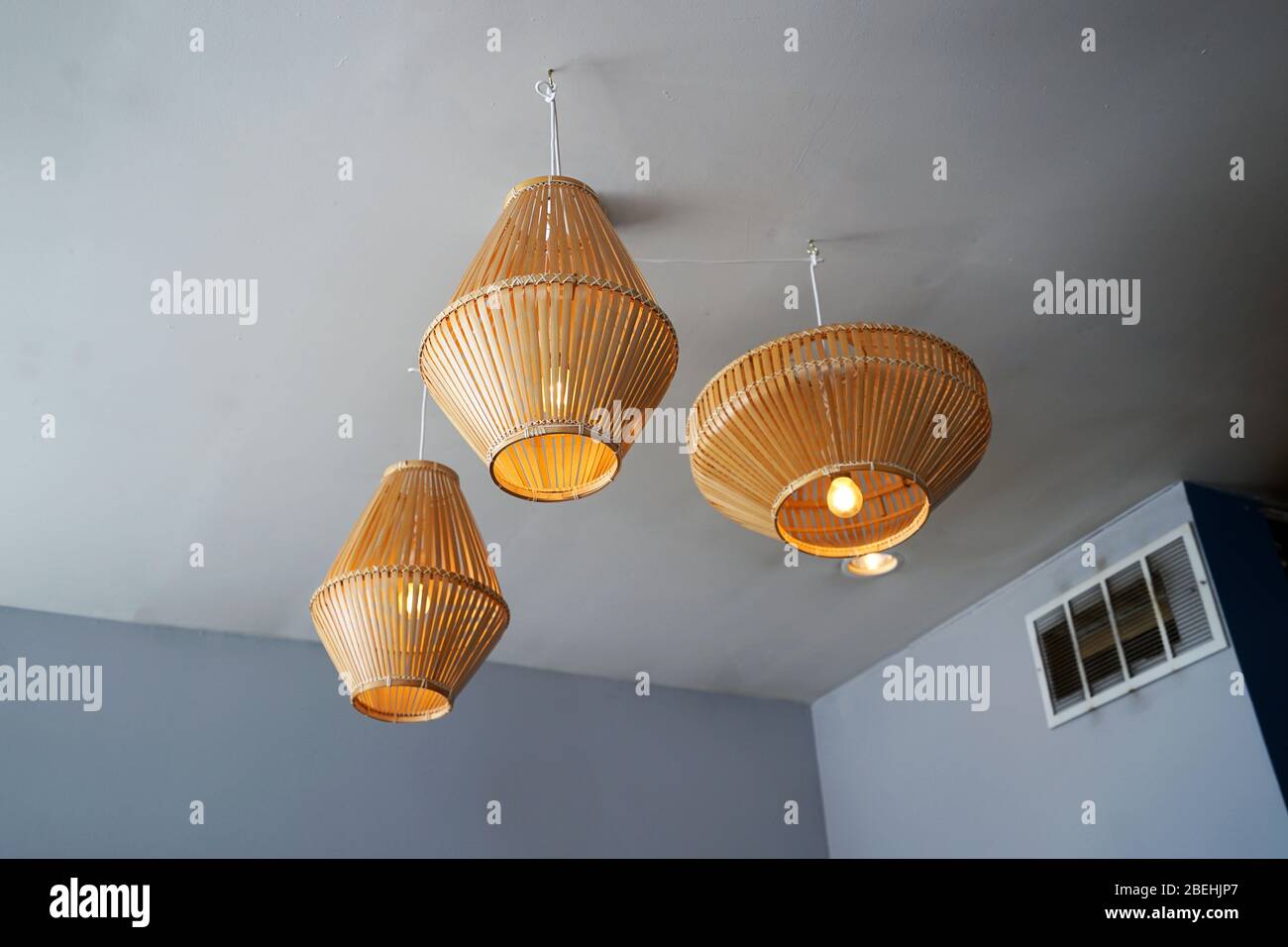 Ceiling decorated with Thai traditional hanging wooden lamp Stock Photo