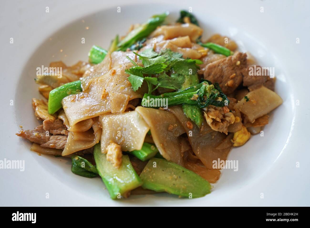 Pad See Ew, Stir fried noodles with black soy sauce and pork Stock