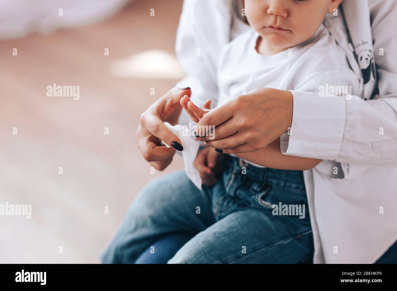 mom and baby rub their hands Stock Photo Alamy