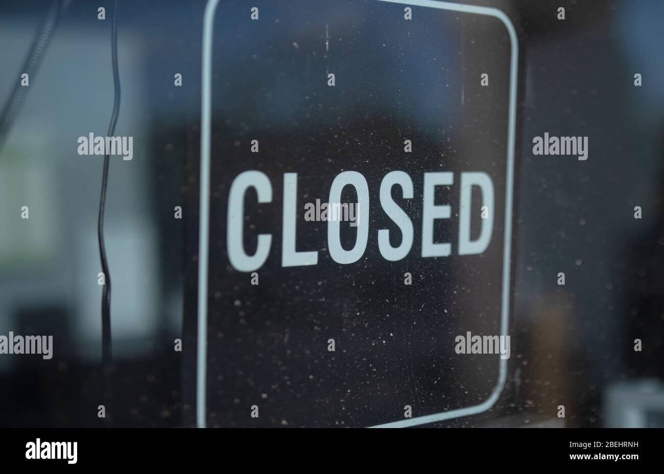 Closed sign on a business' door during the coronavirus quarantine Stock Photo