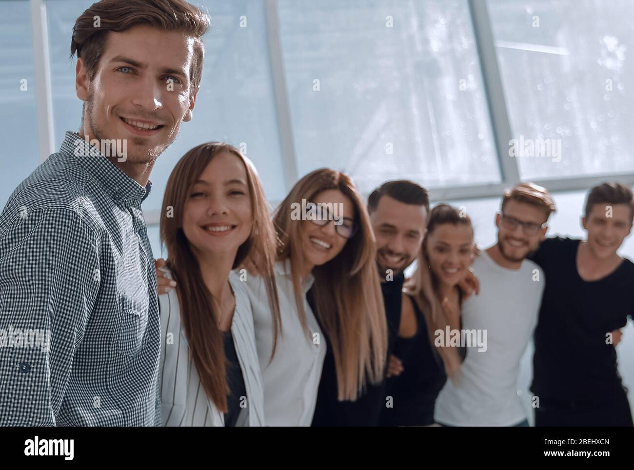 group of successful young people standing in the office Stock Photo - Alamy