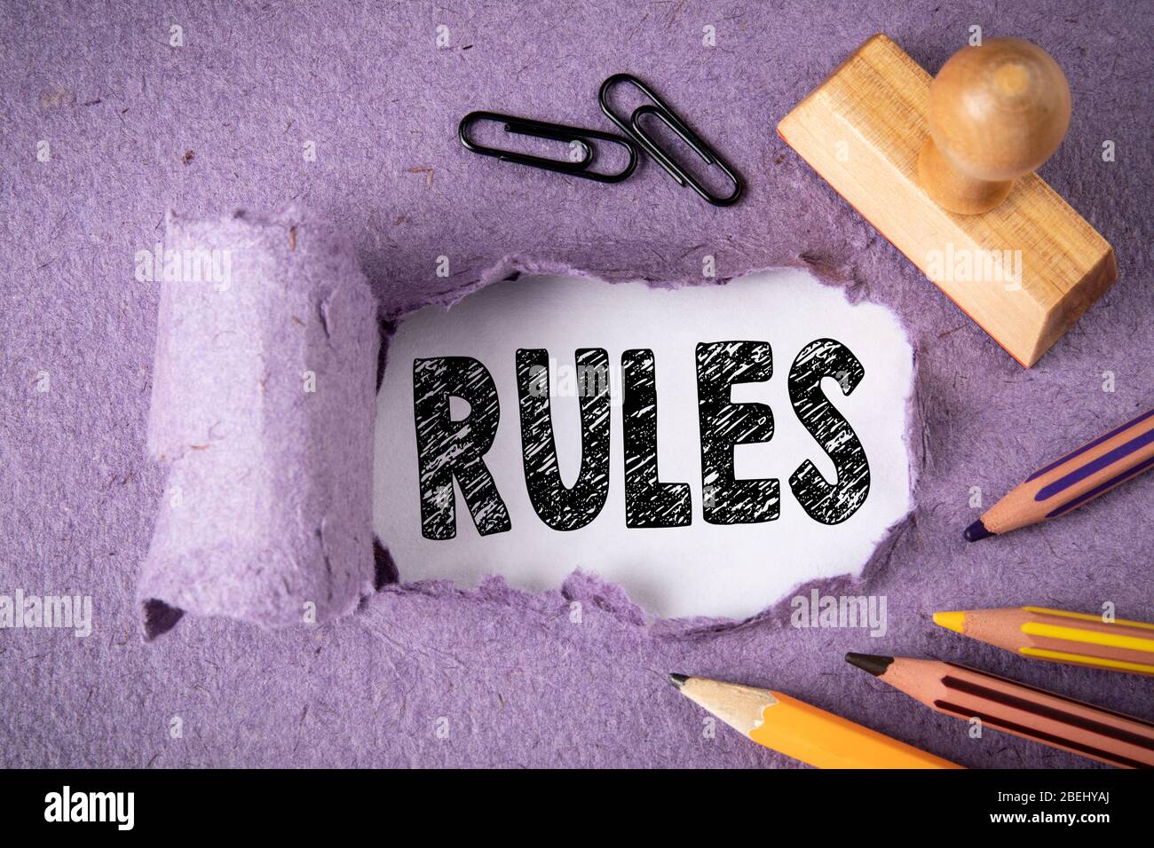 Rules. Audit, guidance, success and business concept. Text under torn paper Stock Photo