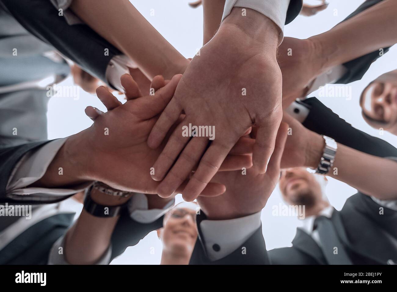 bottom view.the business team shows its unity Stock Photo - Alamy