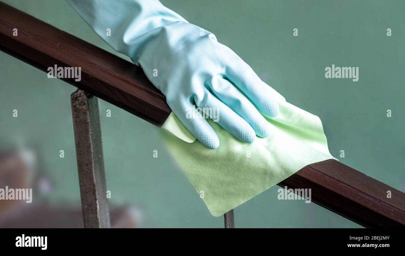 Closeup view of a woman's hand using an antibacterial wet wipe for ...