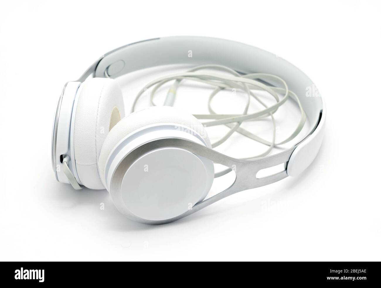 Close up of white headphones on white background. Stock Photo