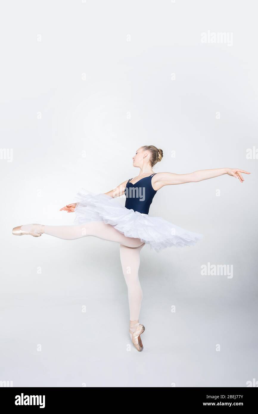 Graceful classic ballerina dancing, posing isolated on white studio  background. Tender peach cloth. The grace, artist, movement, action and  motion concept. Looks weightless, flexible. Fashion, style Stock Photo -  Alamy