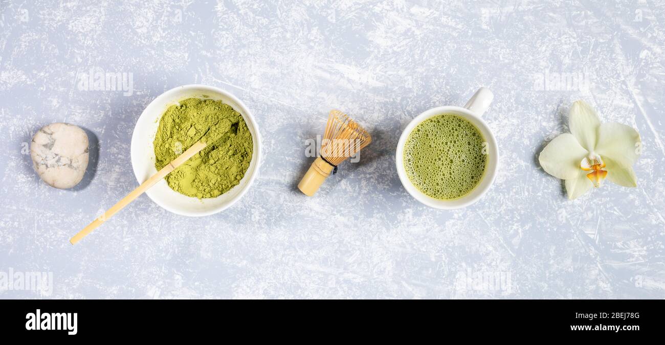 Glass Cup With Japanese Matcha Green Tea Bamboo Whisk For Whipping And Leaves On Stones Laid Out In Row On Grey Textured Backdrop Natural Drink With Stock Photo Alamy