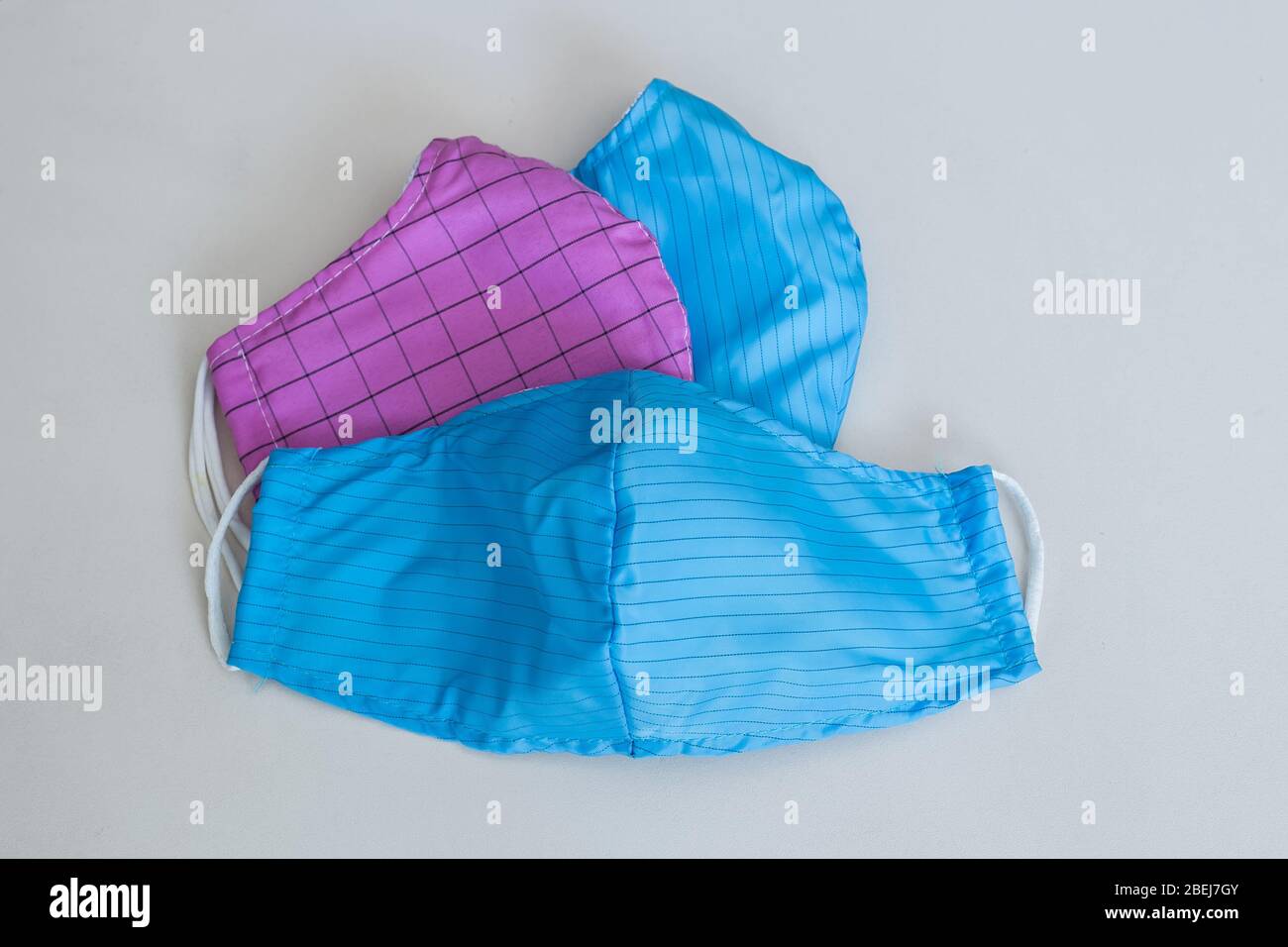 Three anti dust cloth face mask help people avoid getting sick. Typical Vietnamese cloth face mask for pollution and virus outbreak protection Stock Photo
