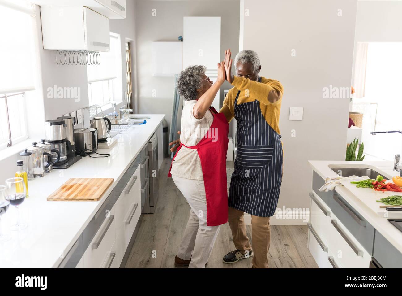 A senior African American couple dancing in the kitchen Stock Photo - Alamy