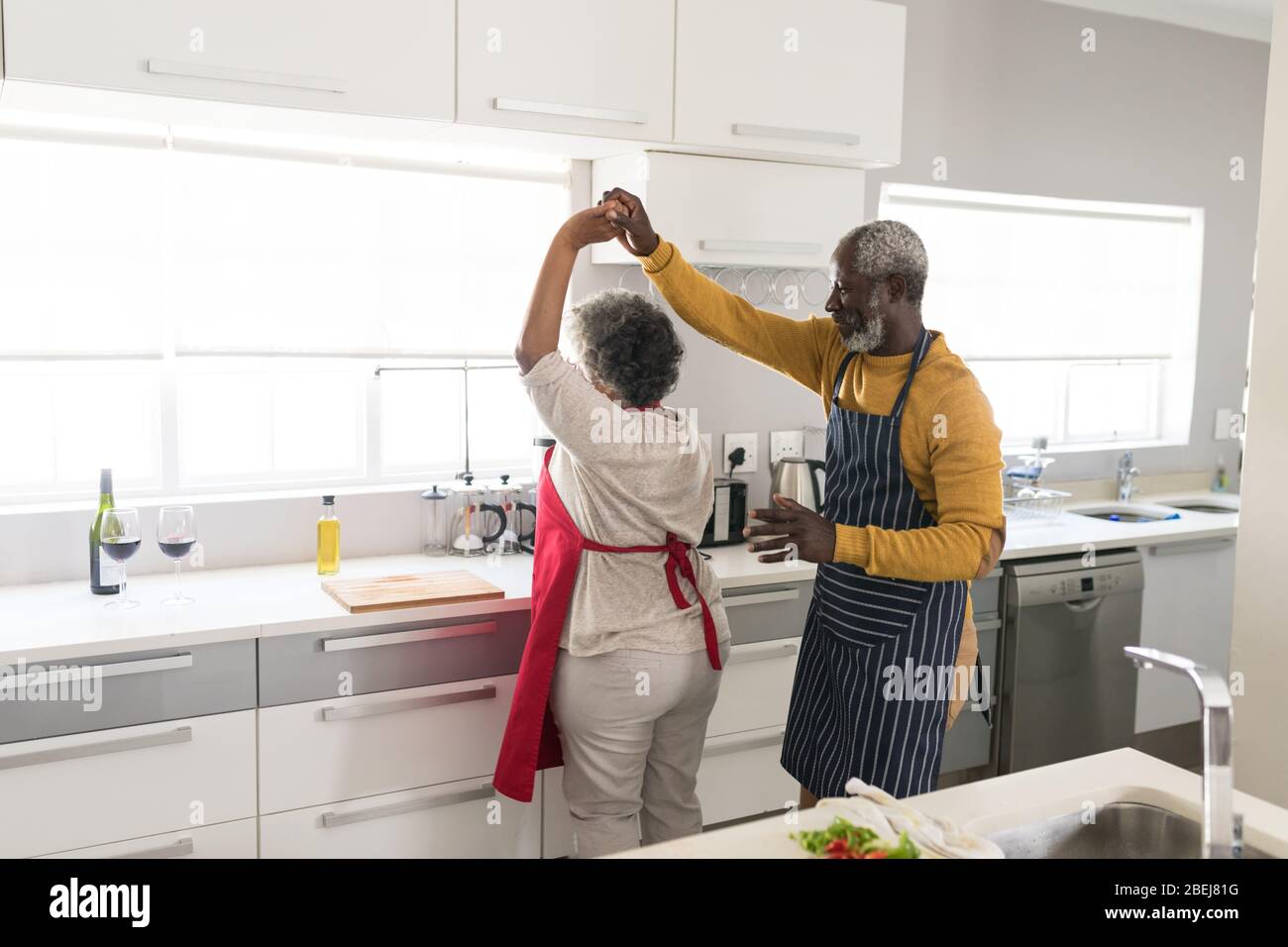 A senior African American couple dancing in the kitchen Stock Photo - Alamy