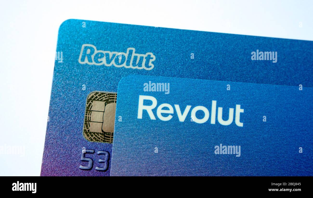 Revolut Bank cards. The re-branded card with new updated Revolut logo on top of old bank card. Close up photo. Stock Photo