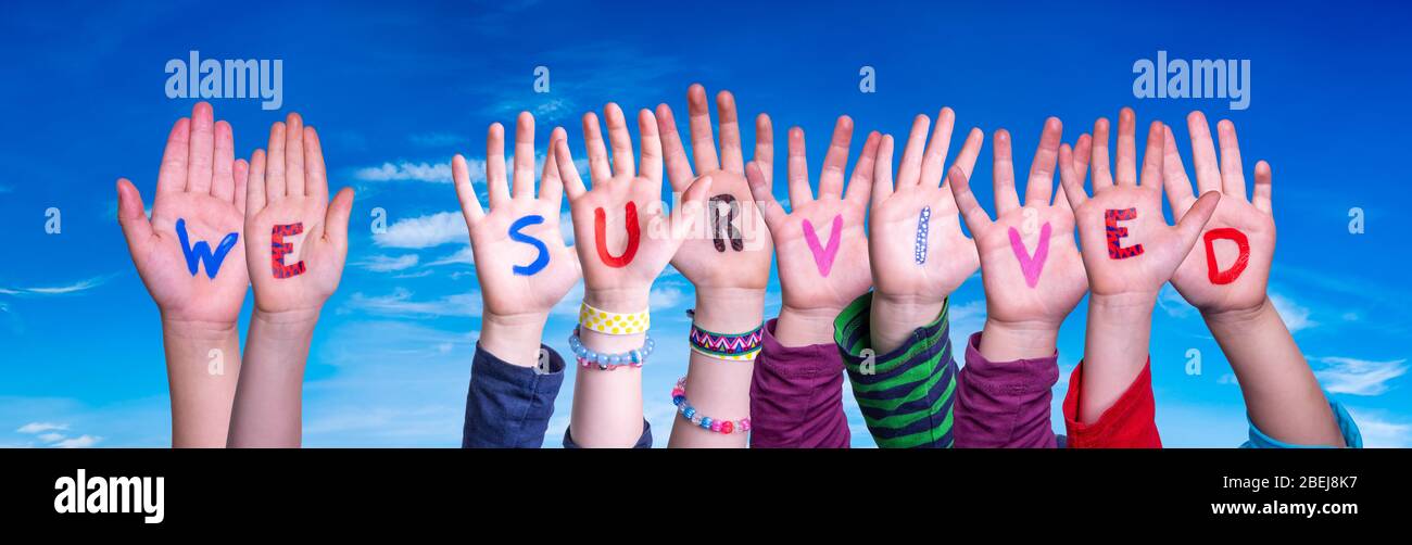 Children Hands Building Word We Survived, Blue Sky Stock Photo