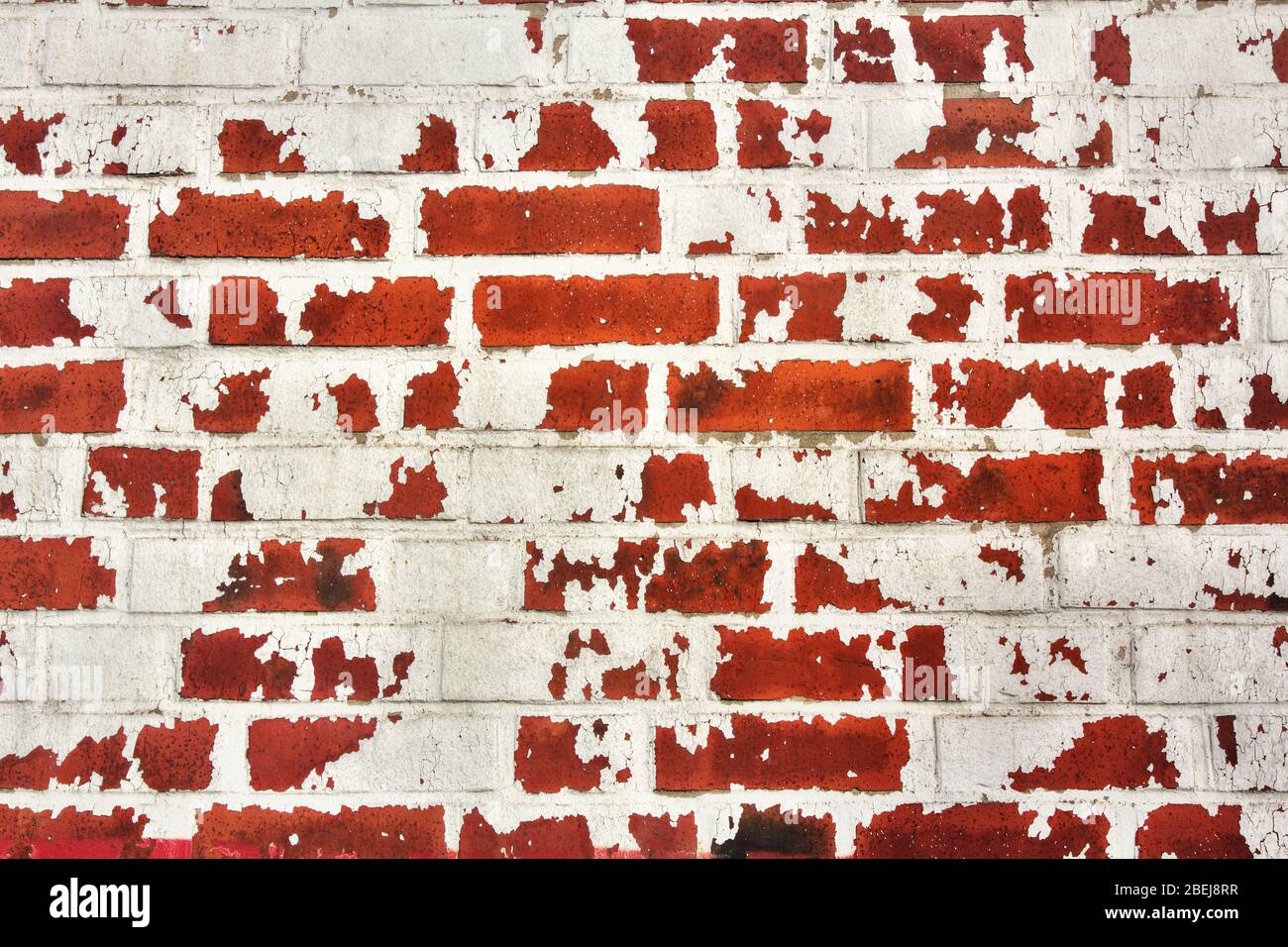 Abstract Background, Wall of red bricks with rest of white color. Stock Photo