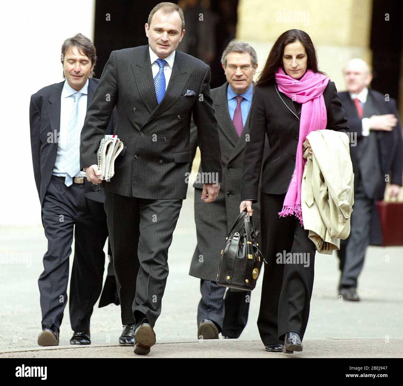 Major Charles Ingram 39 and his wife Diane 39 arriving at Southwark Crown Court accompanied by there agent David Thomas (Far Left) The couple, along with Tecwen Whittock 53 all deny 'procuring the execution of a valuable security by deception' on the game show Who Wants To Be A Millionaire on September 10, 2001. Stock Photo