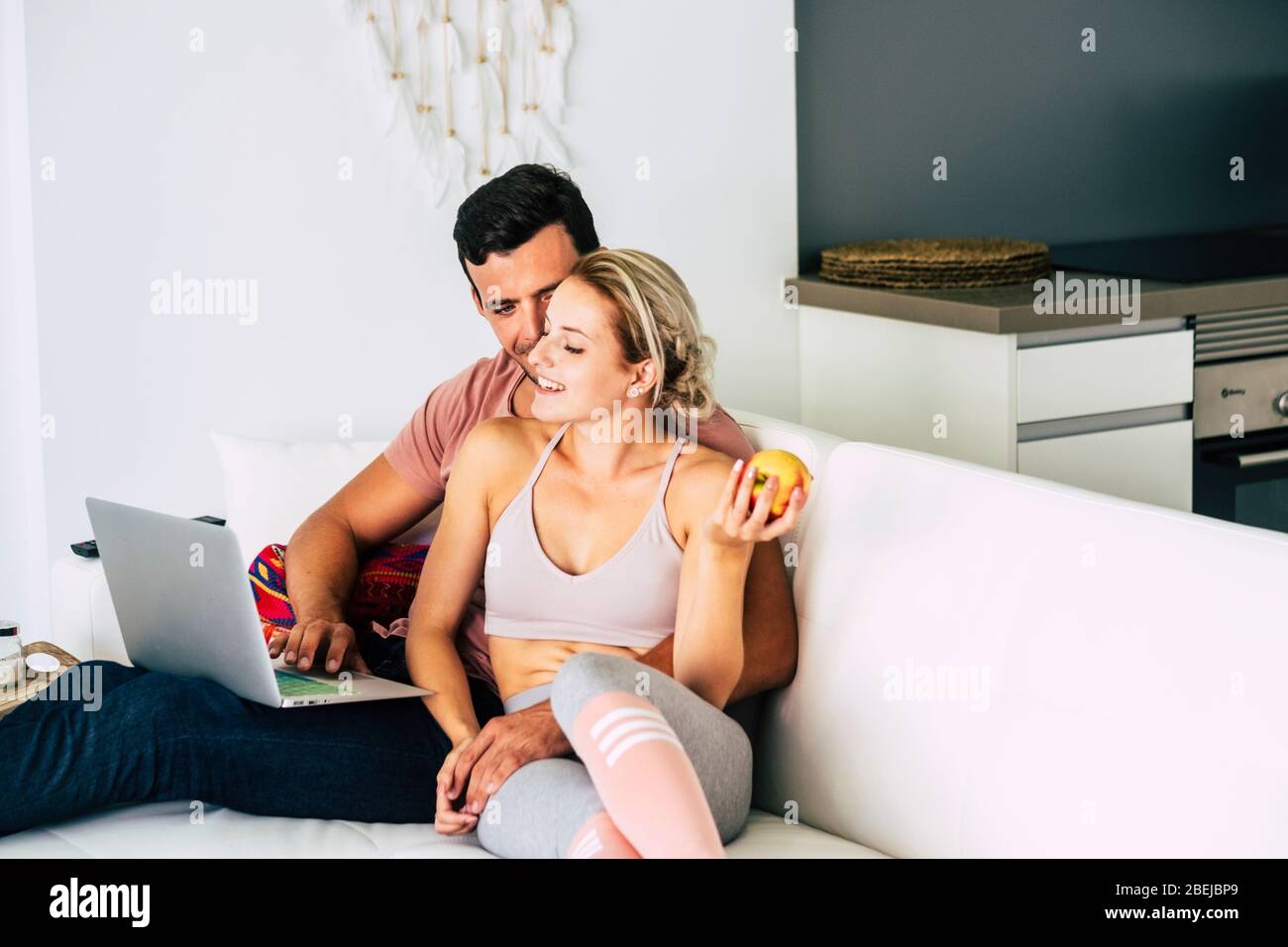 Beautiful Young Couple Work At Home With Internet Connection And Laptop Computer Concept Of People With Healthy Lifestyle And Relationship Quarant Stock Photo Alamy
