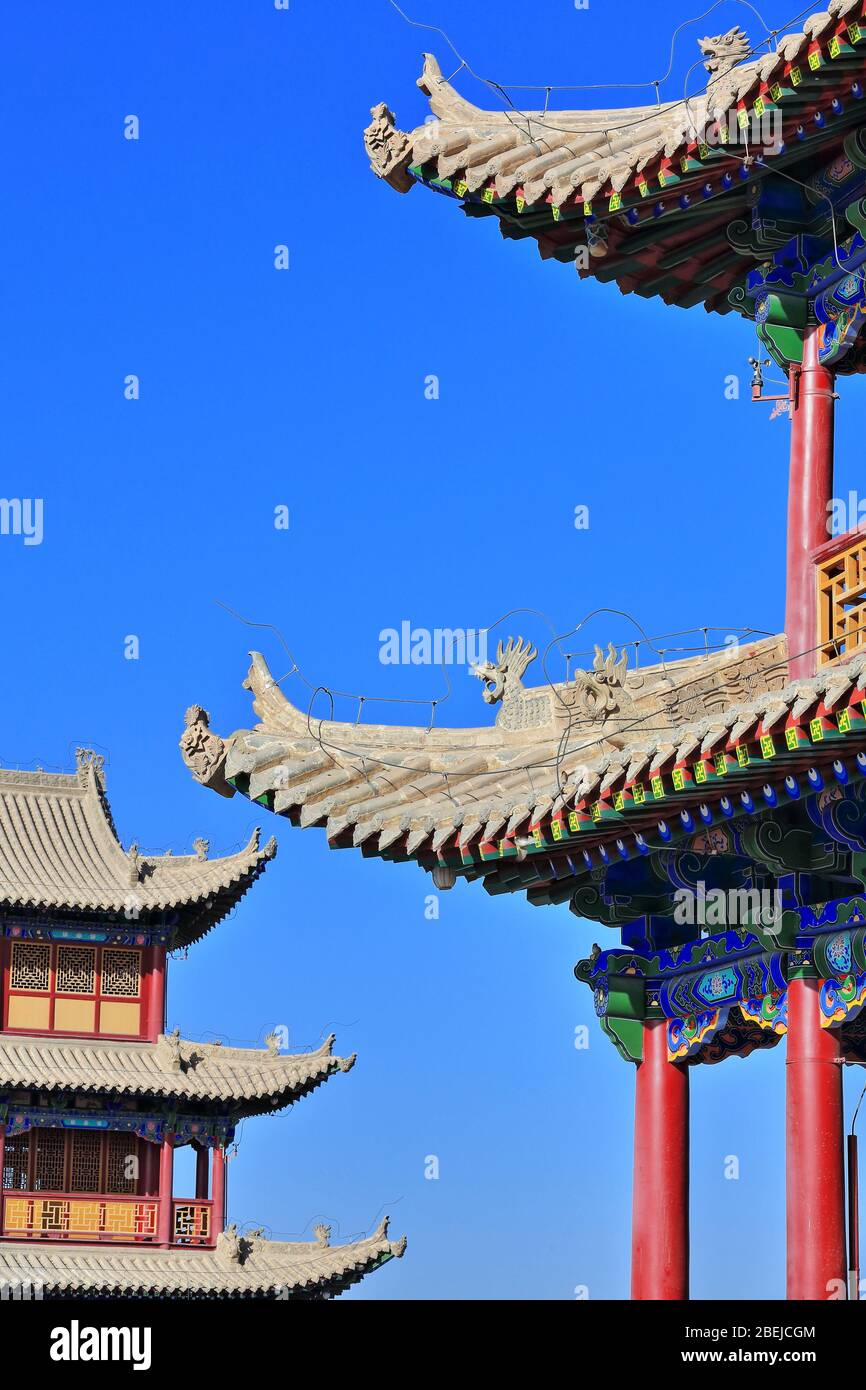 Upturned eaves with chiwen and chishou ornate-Xieshan style roof-Jiayuguan fortress-Gansu-China-0787 Stock Photo
