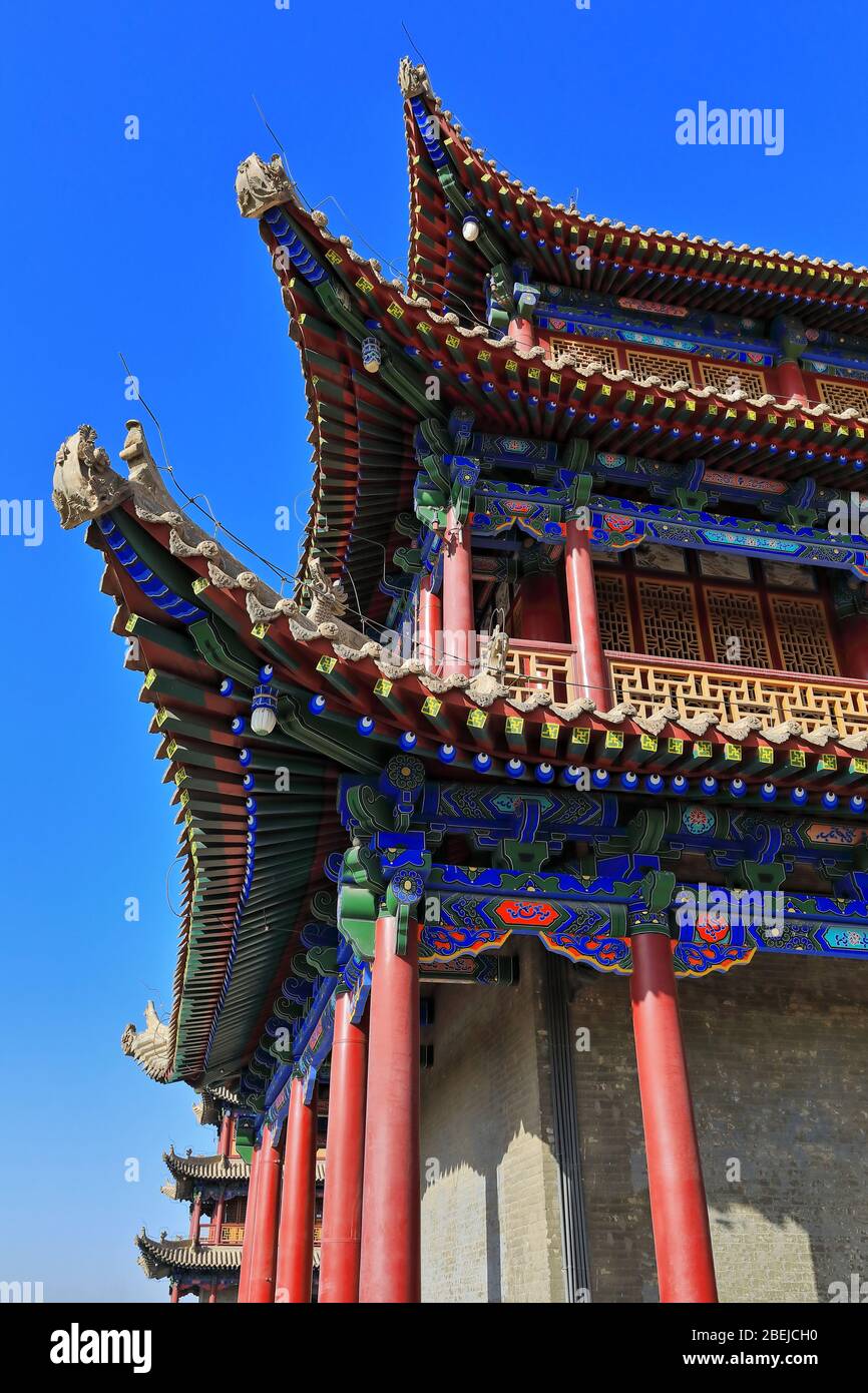 Upturned eaves with chiwen and chishou ornate-Xieshan style roof-Jiayuguan fortress-Gansu-China-0790 Stock Photo