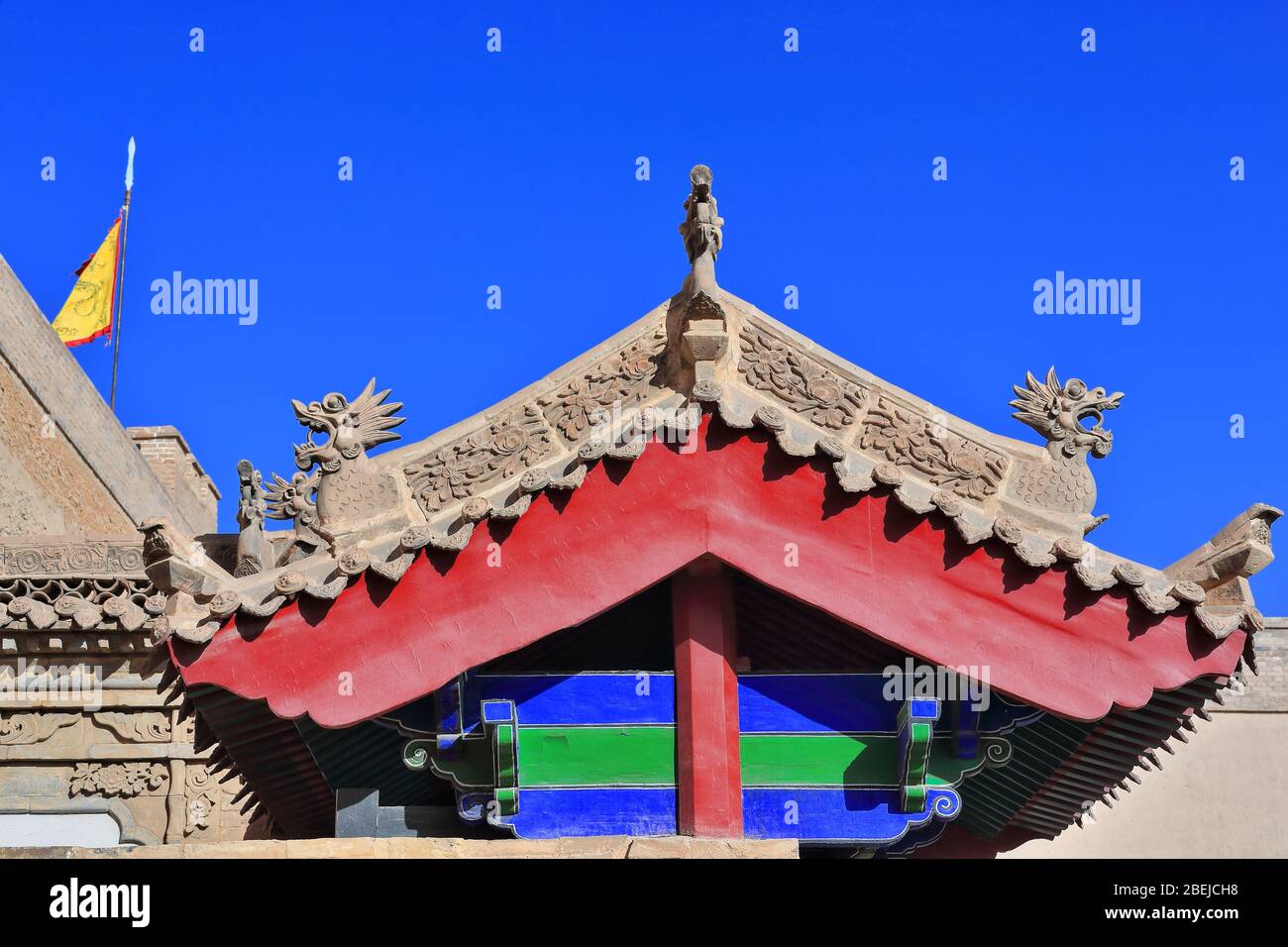 Xieshan roof-wooden beams-flag on turret-inner wall-Jiayu Guan fort. Jiayuguan city-Gansu-China-0793 Stock Photo