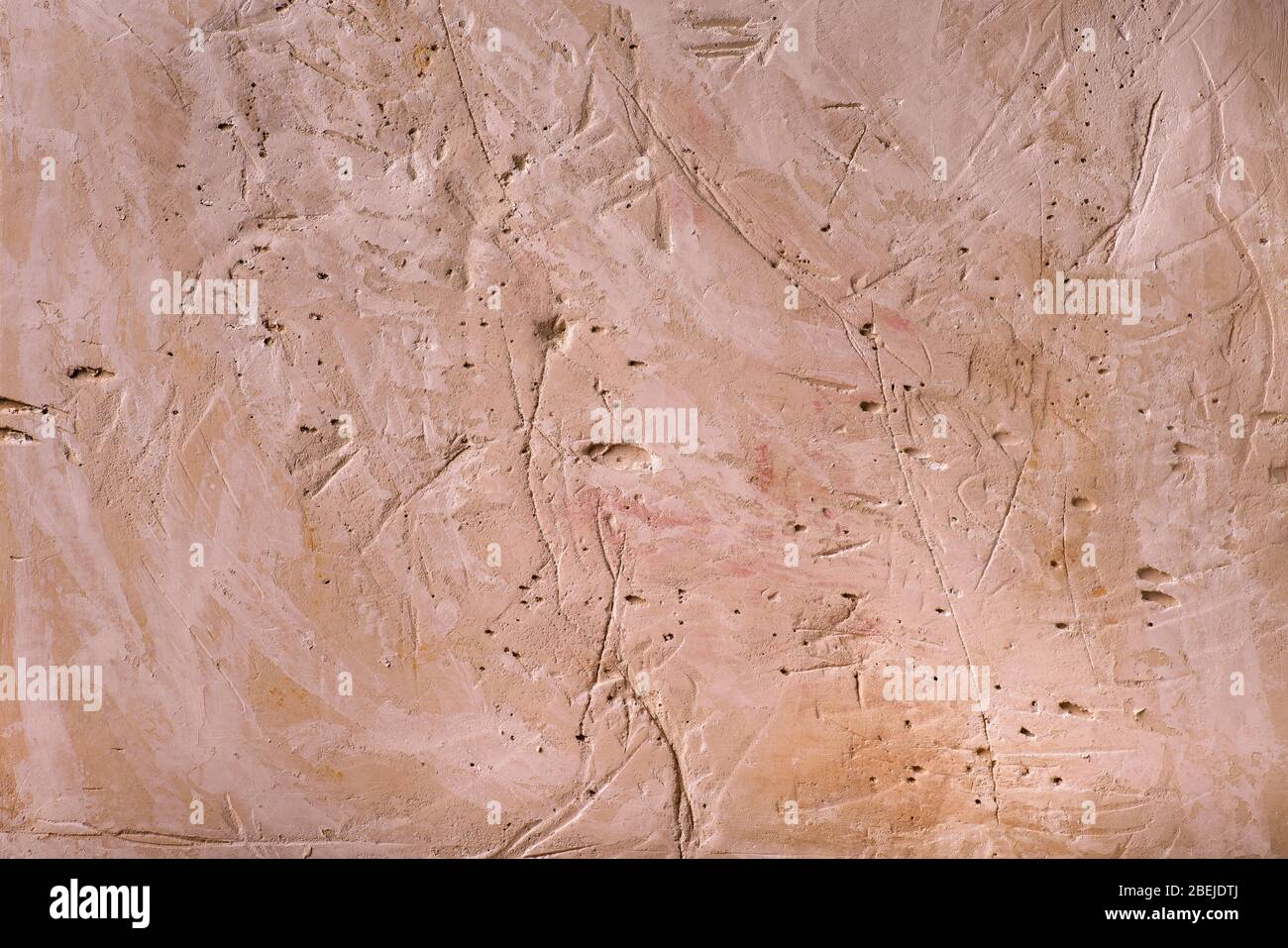 plaster structure scratched and yellowed Stock Photo