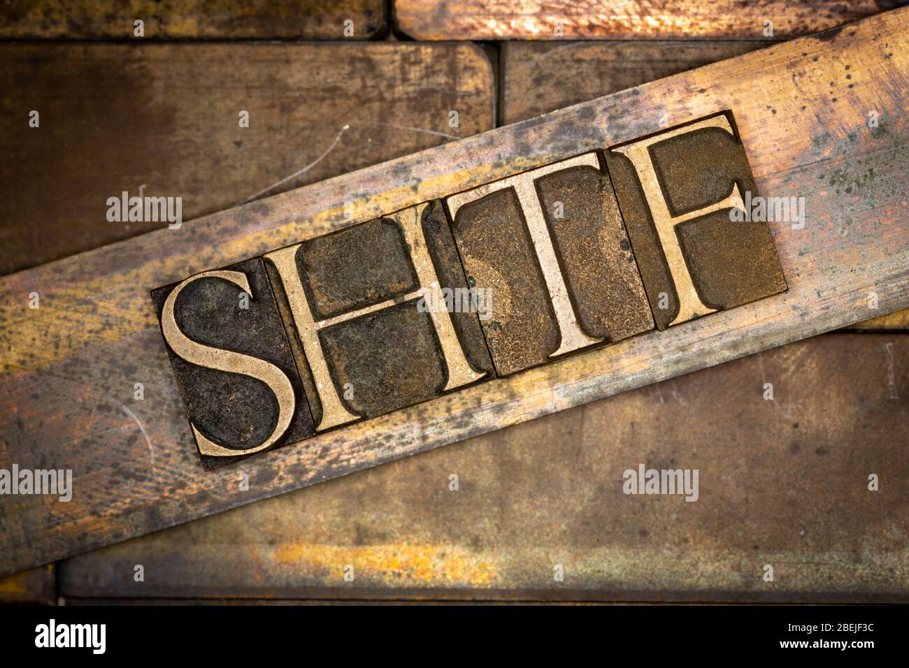 Photo of real authentic typeset letters forming capitalized SHTF text ...