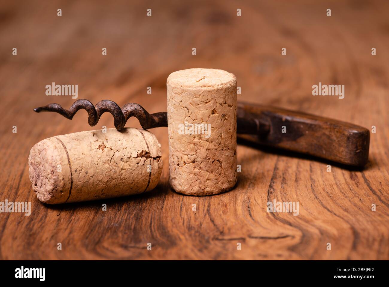in the foreground, corks of Italian wine, and vintage corkscrews Stock Photo