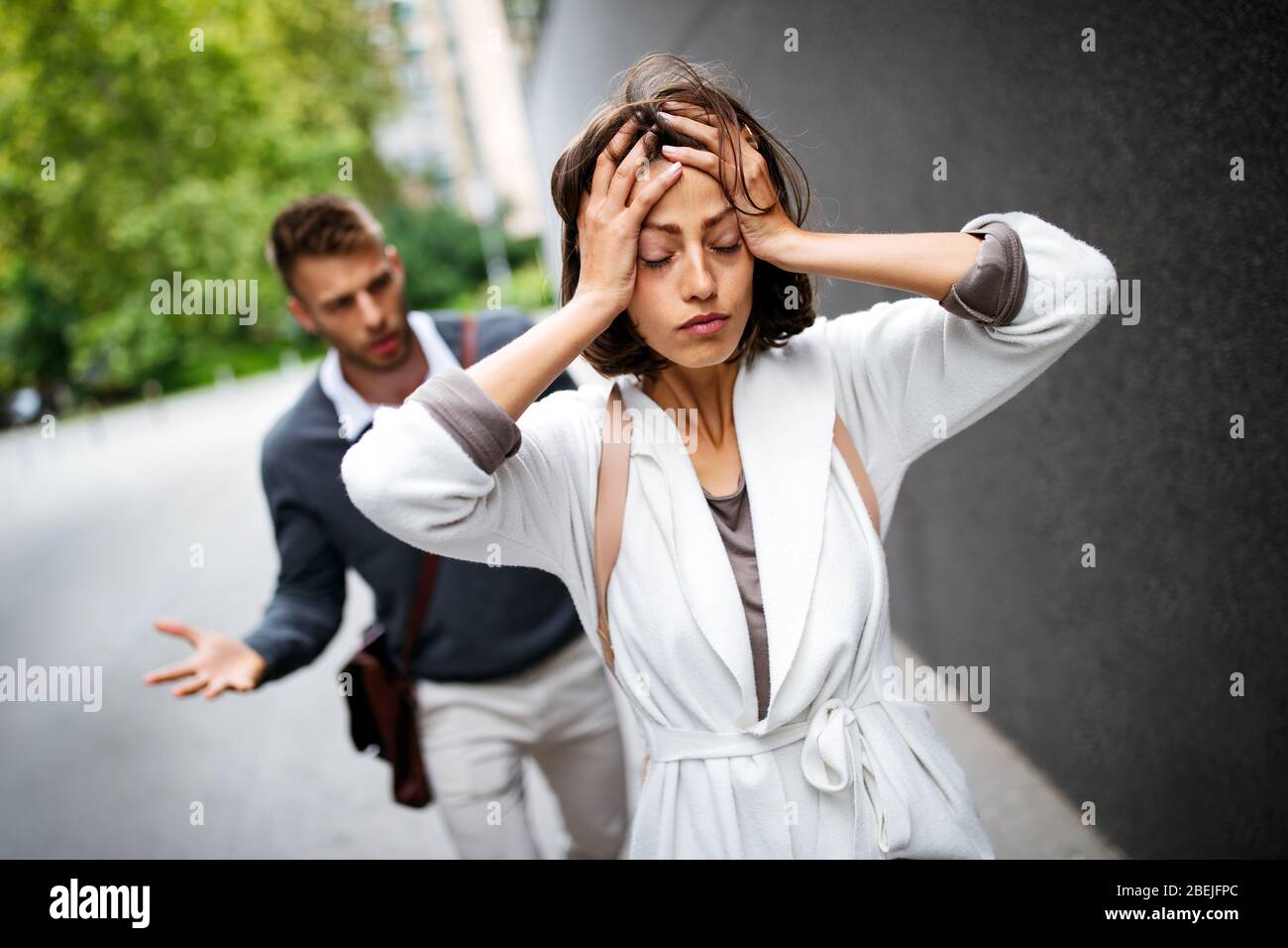 Breakup of couple with man and sad girlfriend outdoor. Divorce, couple, love, pain concept. Stock Photo