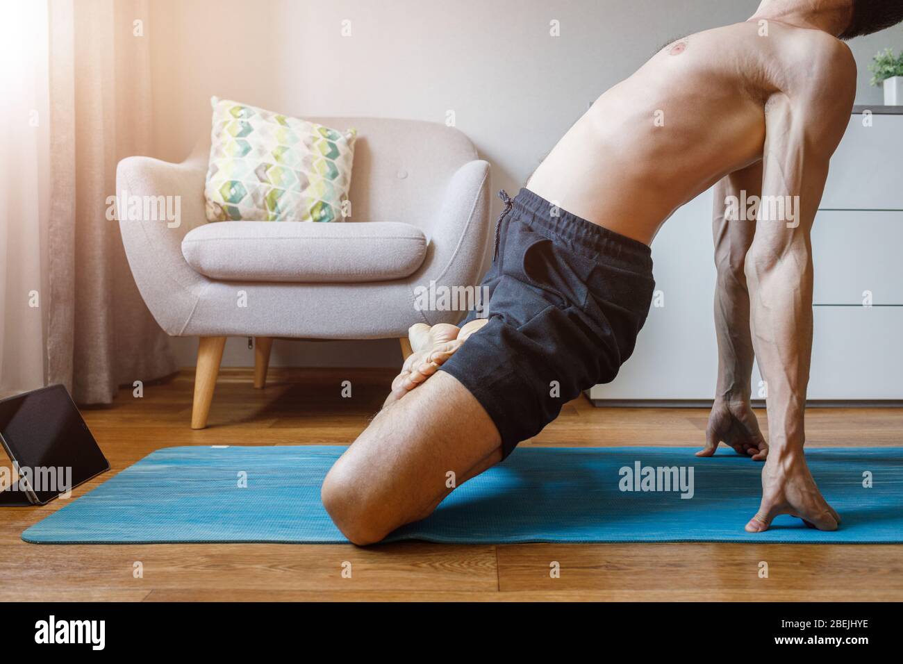 Man Practicing Yoga At Home With Online Yoga Class Stock Photo Alamy Man Practicing Yoga At Home With Online Yoga Class Stock Photo Alamy