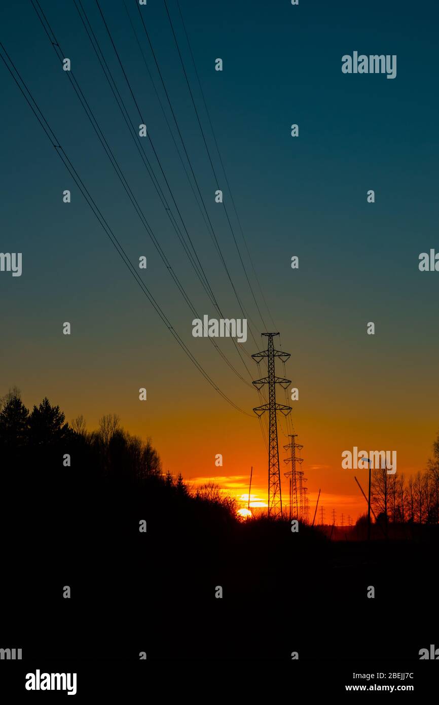 High voltage towers aganist the beautiful sunset Stock Photo - Alamy